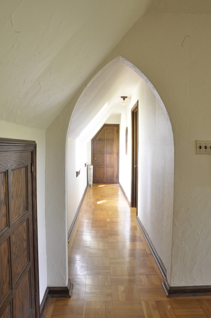 arched hallway and bedroom door