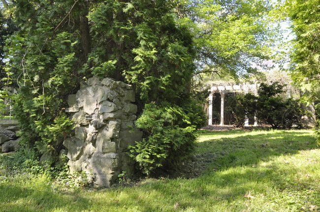 secret garden stone pillar and pergola