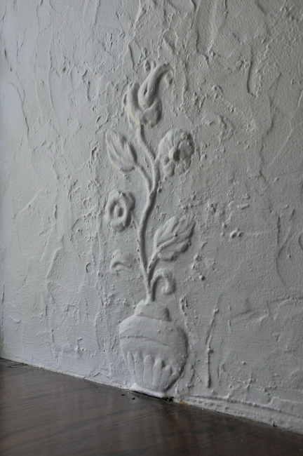 vintage floral plaster impression on wall
