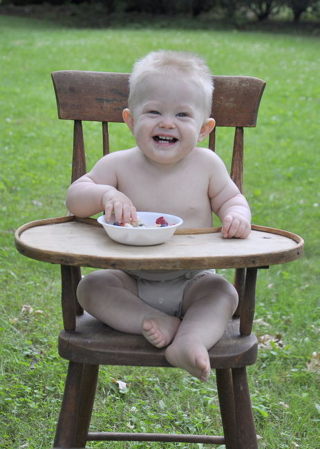 happy baby eating shortcake