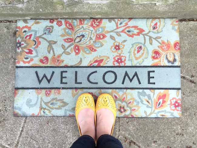 yellow shoes and welcome mat